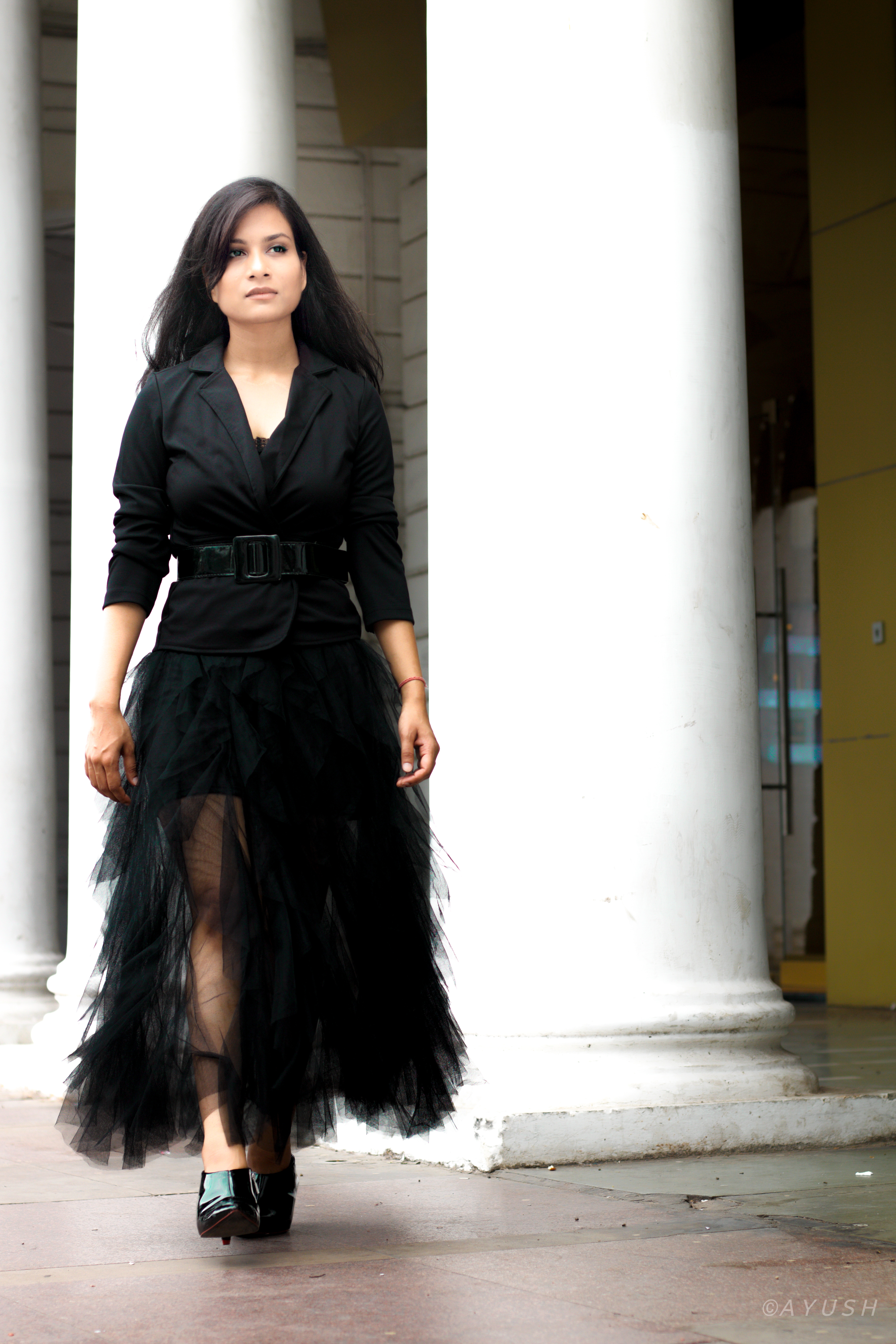 Styling the black tulle skirt with black blazer and waist belt