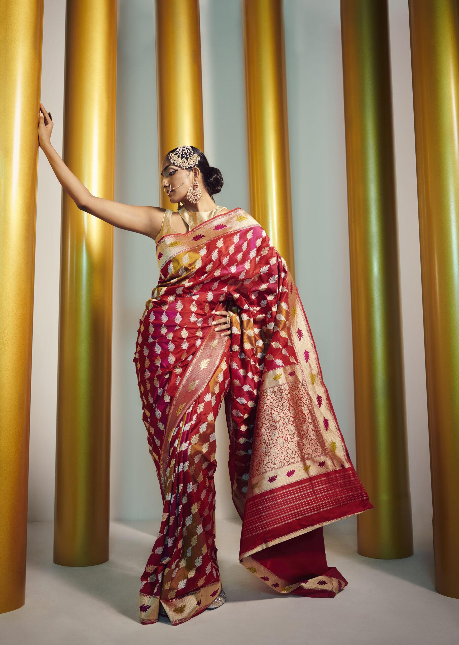 women in red banarsi sari by resa by ushnakmals