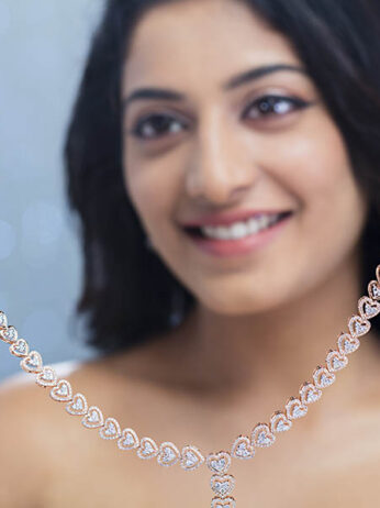 women wearing diamond necklace