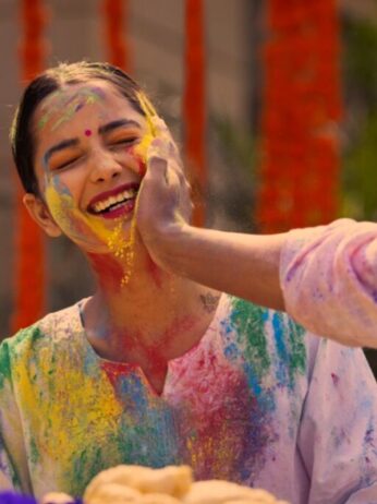 A woman playing Holi