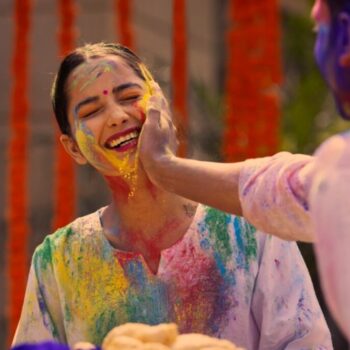 A woman playing Holi