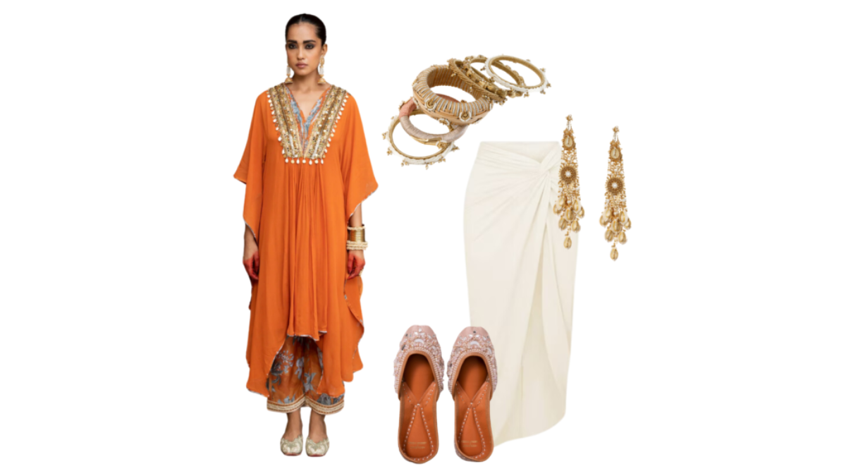 Festive Indo-Western look with an orange embellished shrug, cream draped skirt, traditional bangles, jhumka earrings, and embroidered mojari flats.