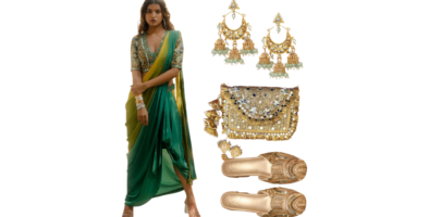 Elegant traditional outfit with a green drape sari skirt, embroidered blouse, gold Kolhapuri flats, statement earrings, and a golden embellished potli bag.